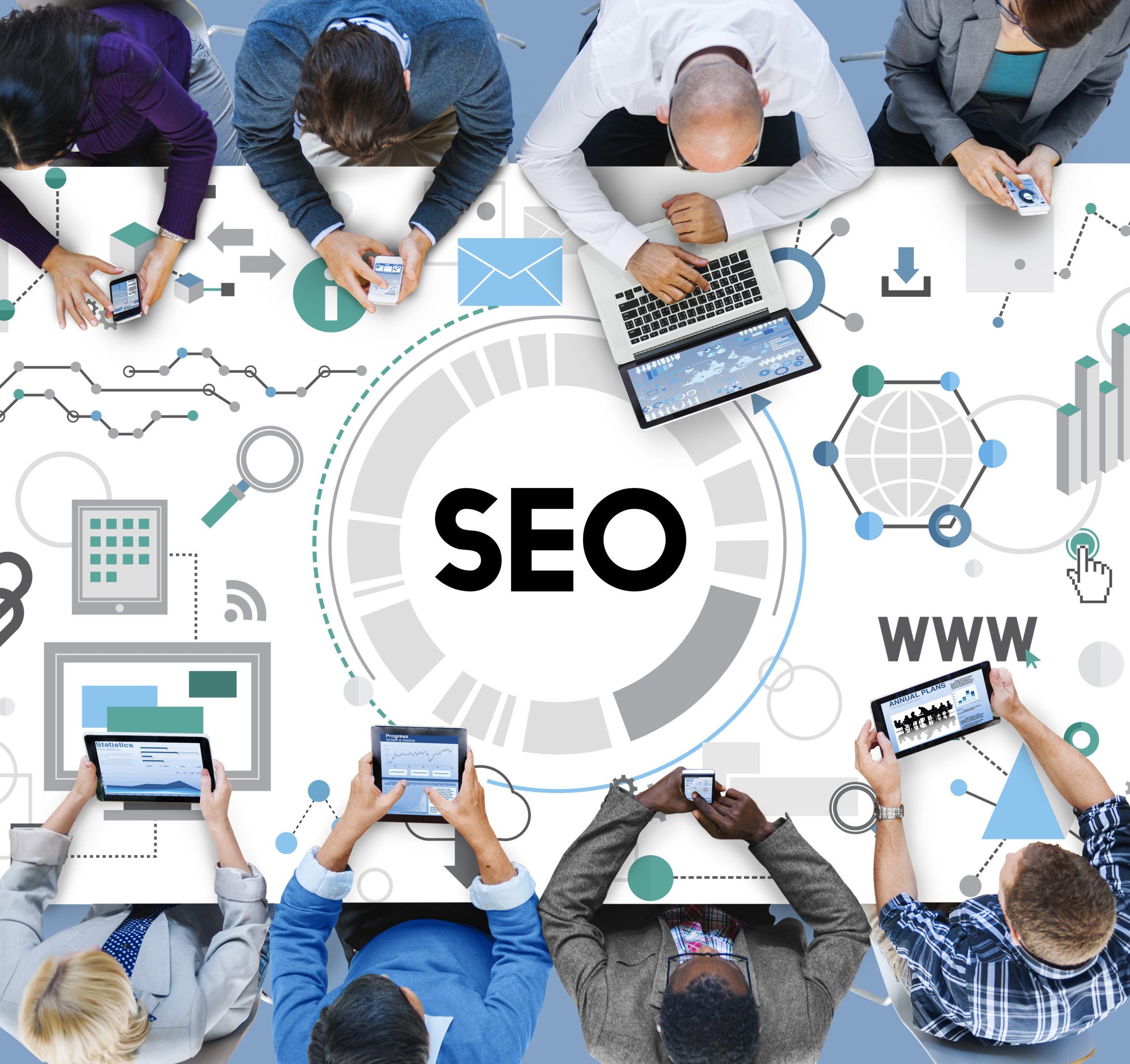 A group of people meeting and sitting on a white table with an SEO word at the center.
