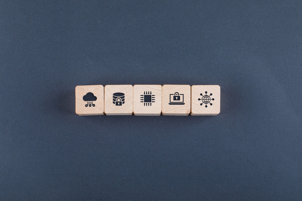 A cloud 'Structured Data' concept, laid out in wooden blocks on a grey background.