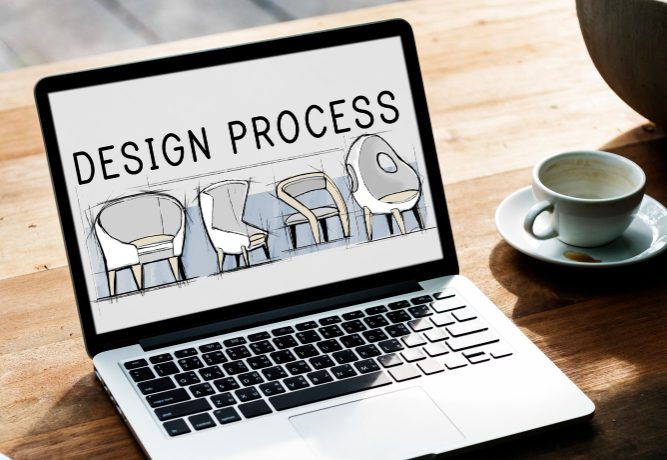 A design process for an interior designing website, shown on a laptop screen with a cup of coffee on the right side of the table.