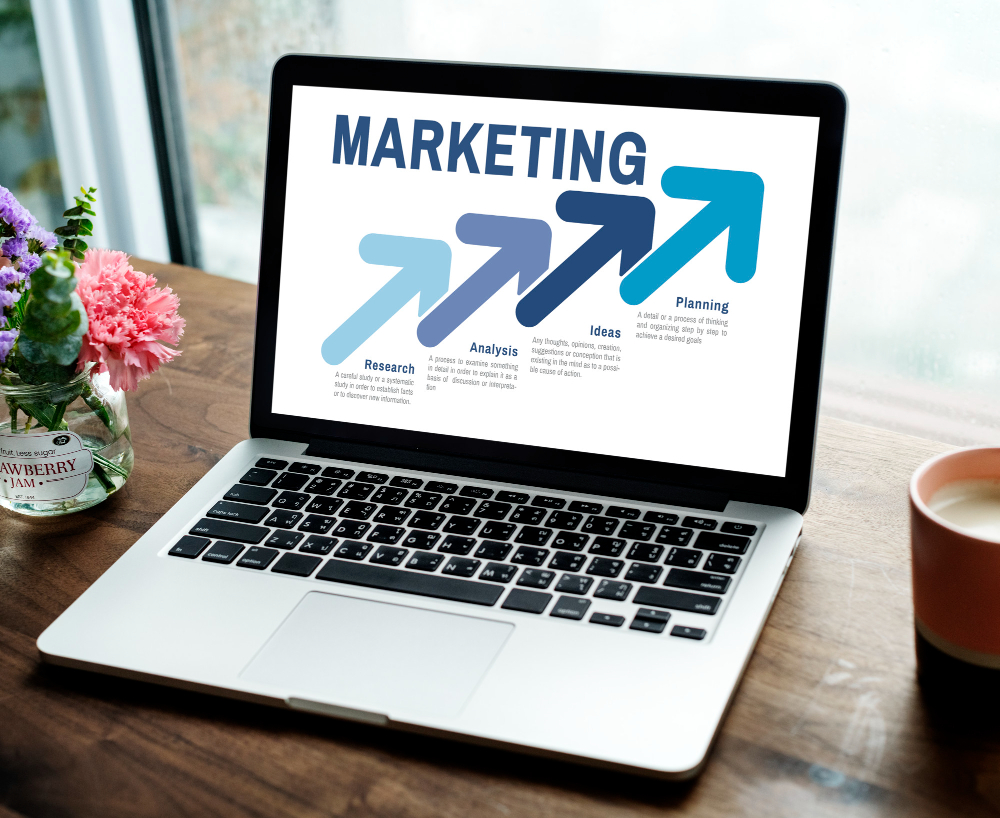 A marketing sales report, shown on a laptop screen.