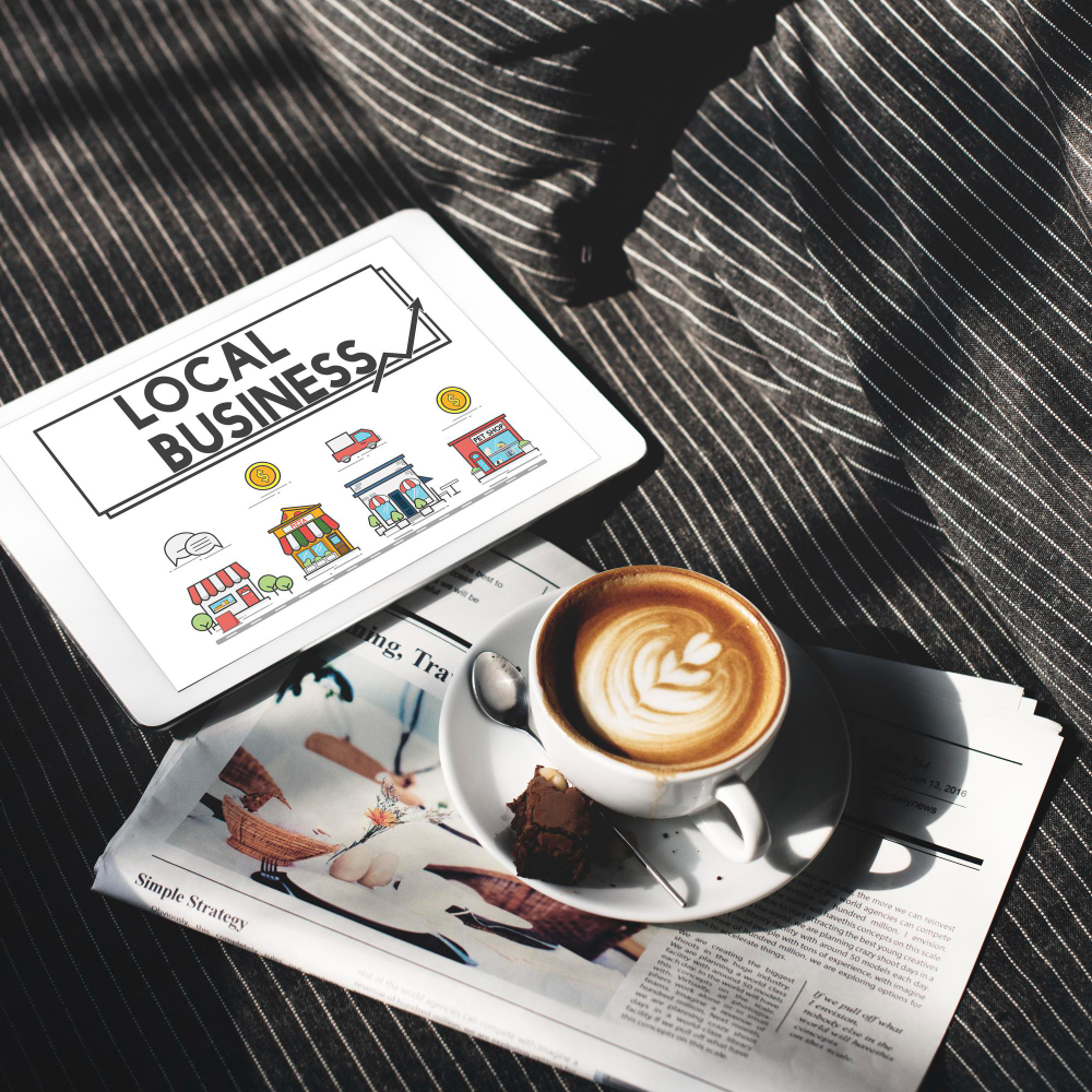 Top view of a small business marketing strategy concept for a restaurant, presented on a smart laptop, with a cup of coffee on lower side of a blanket cover.